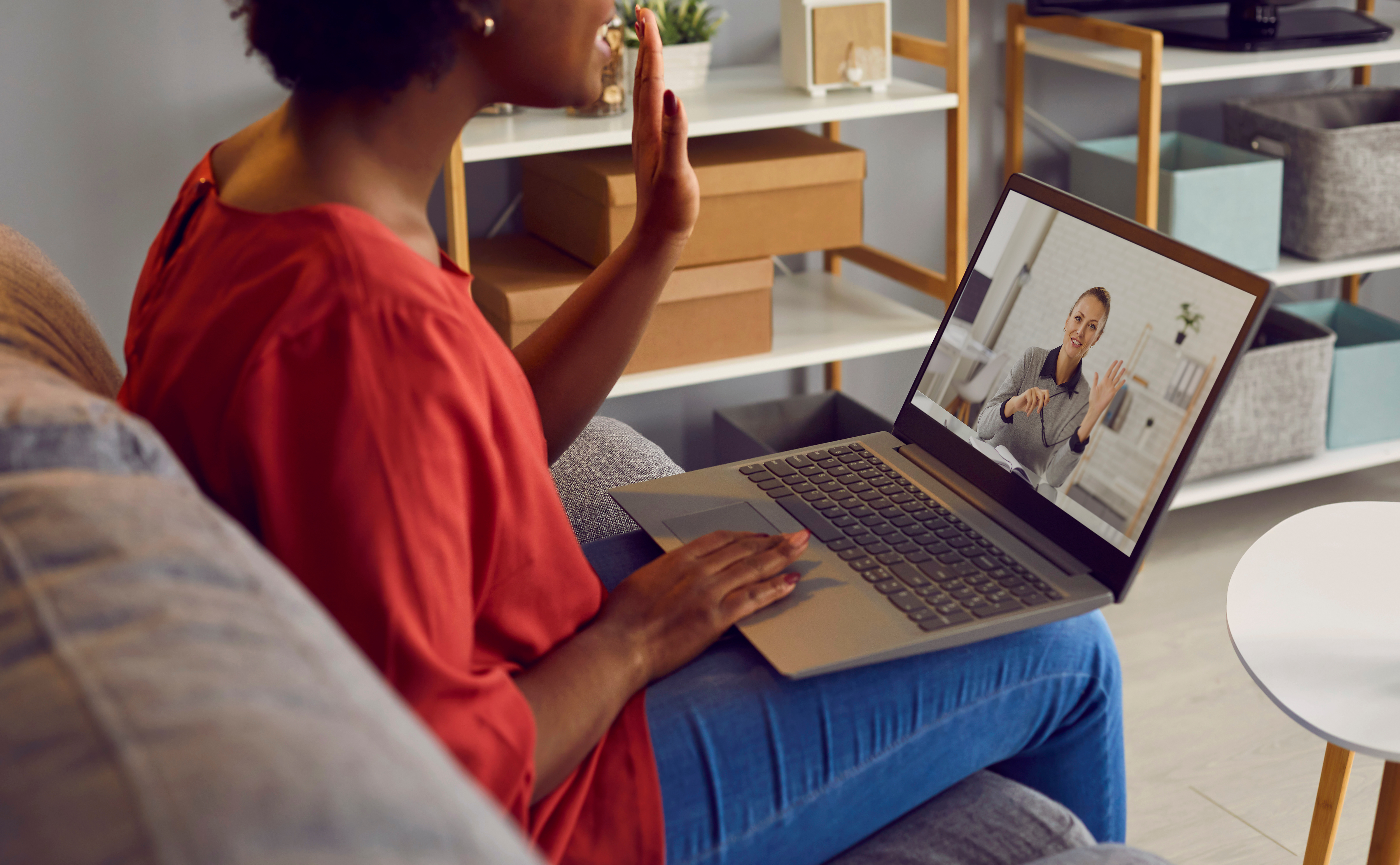 woman sofa laptop